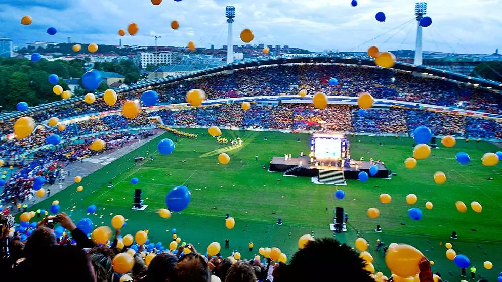 Balloons fall from the stands in a energetic, twilight opening ceremony at the Gothia Cup.