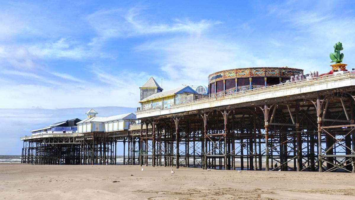 A Blackpool pier on a clear, blue sky day is one of the top 9 places in Blackpool to visit