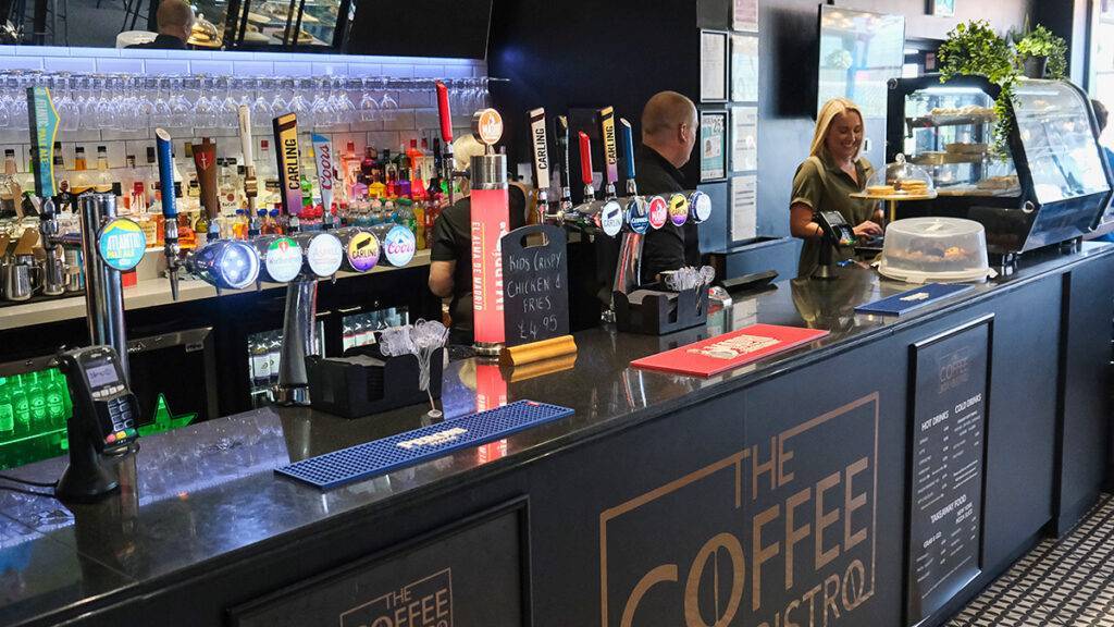 The Coffee Box Bistro bar with two smiley bartenders