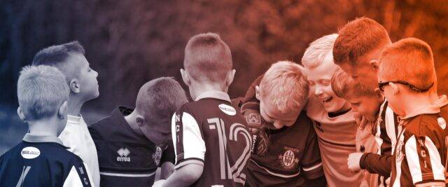 Kids football huddle around and laugh