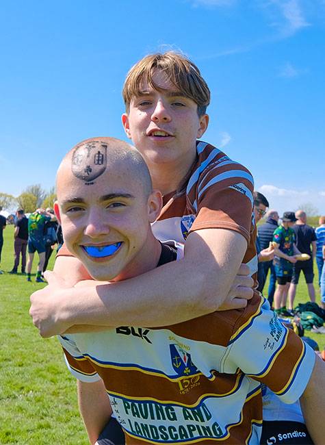 One player piggybacks his teammate as they celeberate