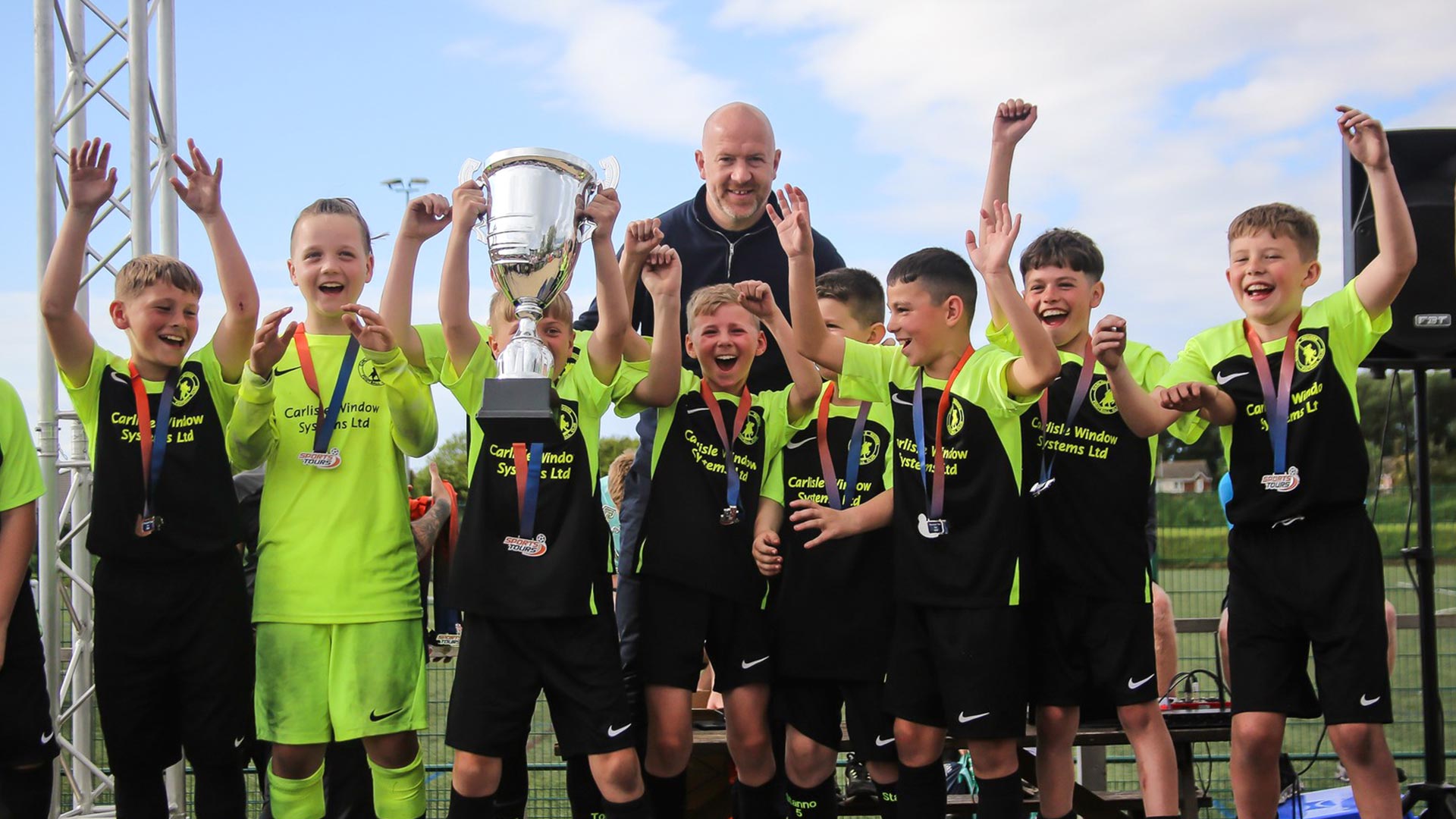 A young football team celebrating their win