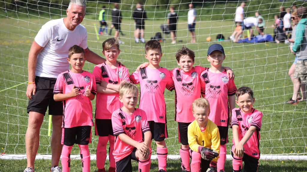 A team photo for a young football team