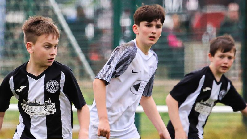 Young footballers playing in the Sports Tours Blackpool May Day Football Tournament