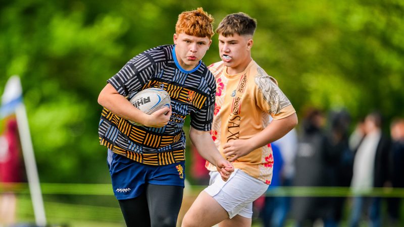 Two young rugby players playing in a tournament