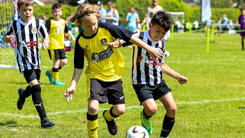 Two young footballers battling it out